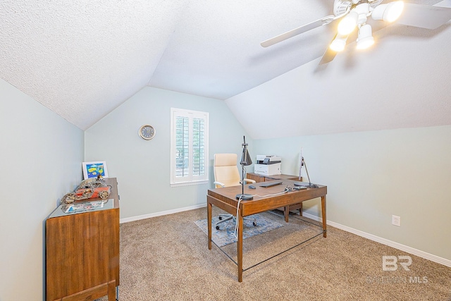 office space with vaulted ceiling, a textured ceiling, ceiling fan, and carpet flooring