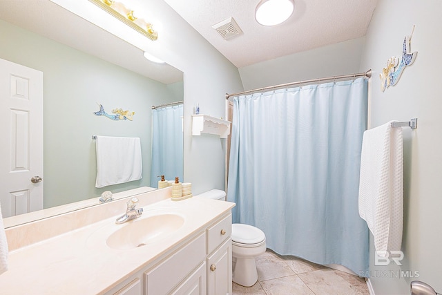 bathroom with toilet, a textured ceiling, tile patterned flooring, curtained shower, and vanity