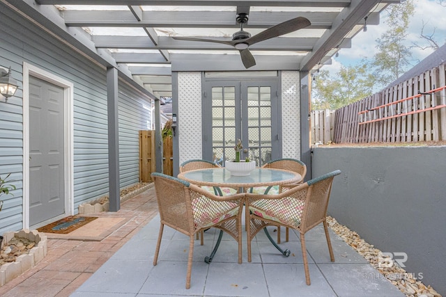 view of patio / terrace with ceiling fan and french doors