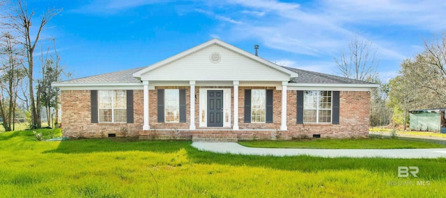 view of front facade with a front yard, crawl space, and brick siding