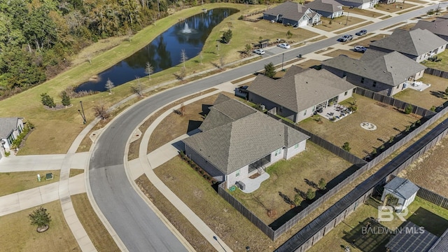 bird's eye view with a water view