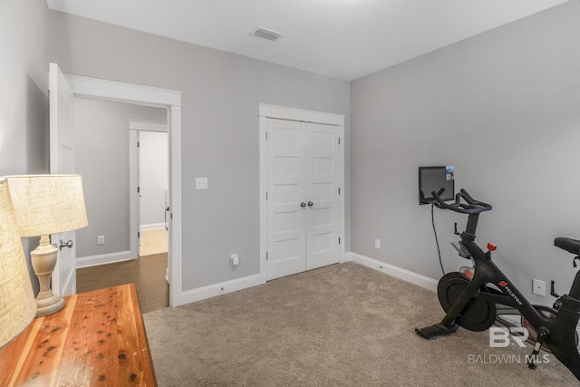 exercise room featuring carpet