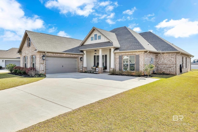 view of front of home with brick siding, a garage, a front yard, and roof with shingles