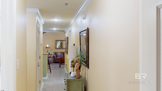 hallway with light tile patterned floors and ornamental molding