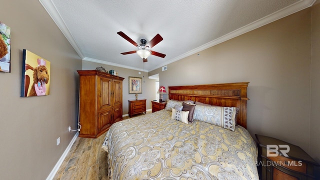 bedroom featuring crown molding, ceiling fan, a textured ceiling, and light wood-type flooring