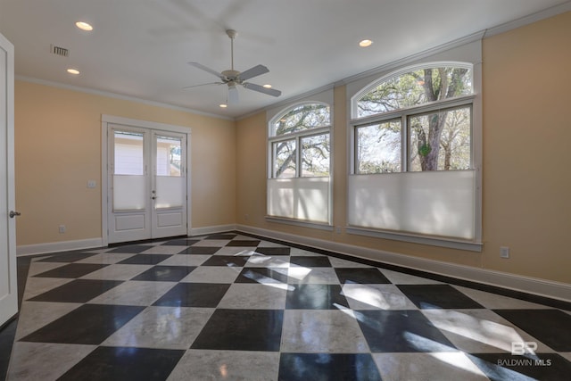 empty room featuring french doors, crown molding, recessed lighting, baseboards, and tile patterned floors