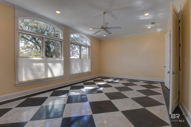 unfurnished room with baseboards, recessed lighting, tile patterned floors, and crown molding