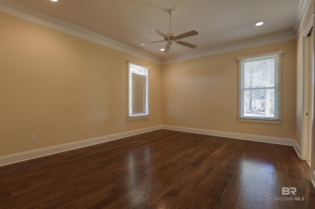 spare room featuring baseboards, a ceiling fan, ornamental molding, dark wood-type flooring, and recessed lighting