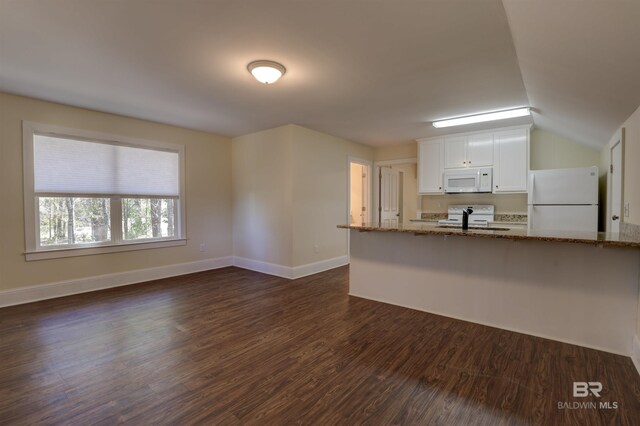 unfurnished living room with dark wood-type flooring and baseboards