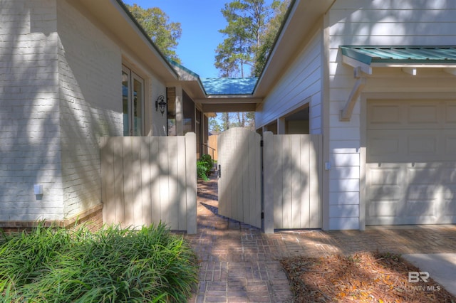 view of home's exterior featuring a gate