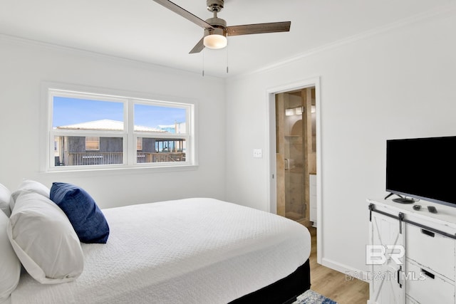 bedroom with ornamental molding, connected bathroom, ceiling fan, and light hardwood / wood-style flooring