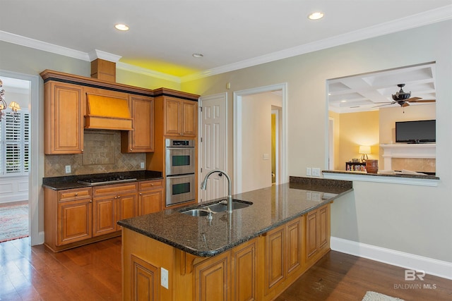 kitchen with double oven, coffered ceiling, sink, and dark wood-type flooring