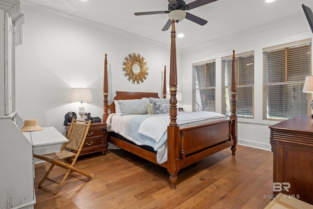 bedroom with baseboards, wood finished floors, ceiling fan, and recessed lighting