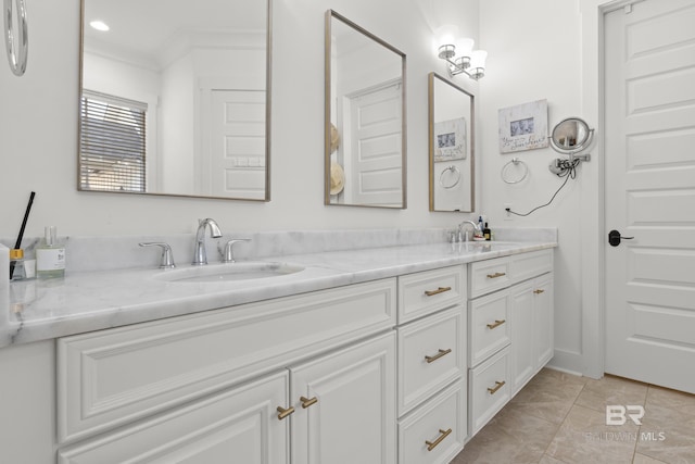 bathroom featuring double vanity, a sink, and tile patterned floors