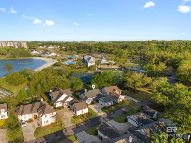 birds eye view of property with a residential view, a water view, and a forest view