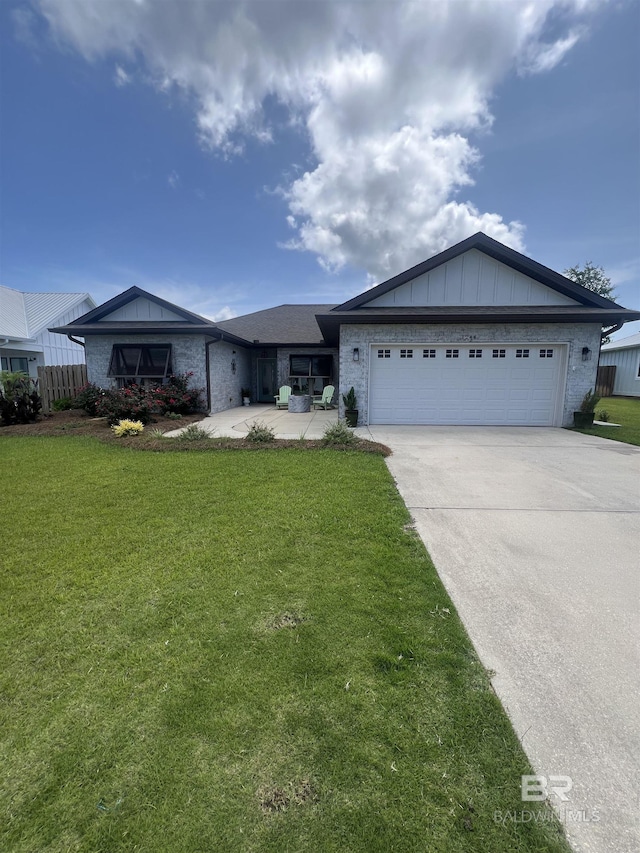 1244 Dorado Way, Gulf Shores, AL 36542 - ranch-style home with a garage, concrete driveway, a front yard, and board and batten siding
