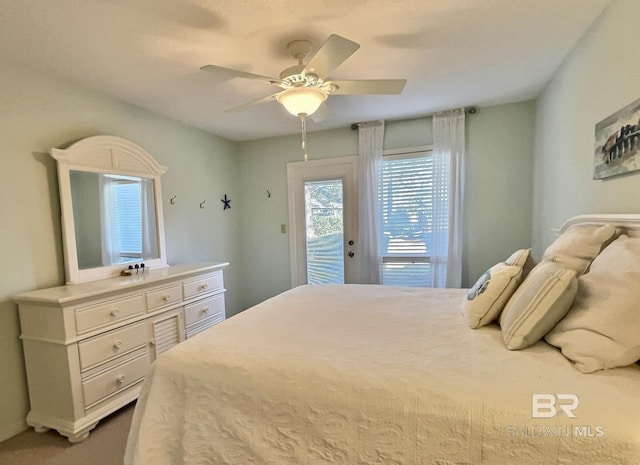 bedroom featuring access to outside and ceiling fan