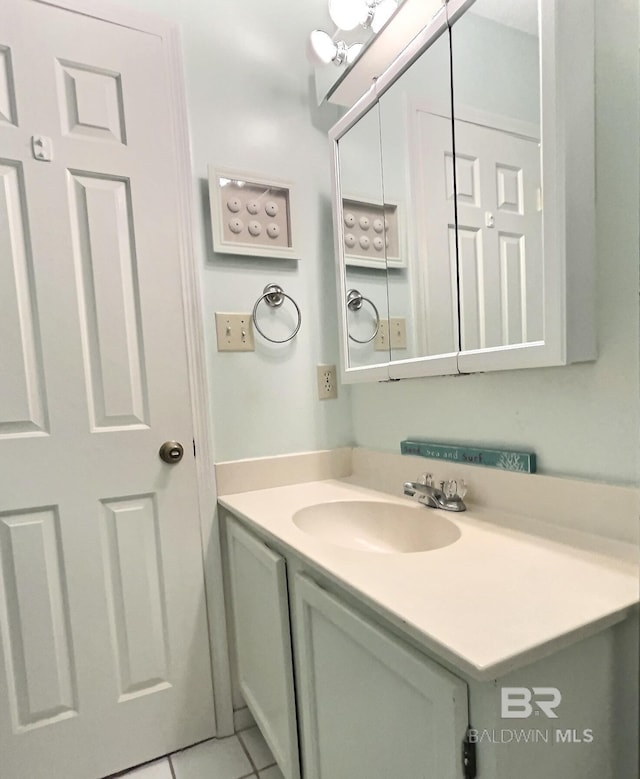 bathroom with vanity and tile patterned floors