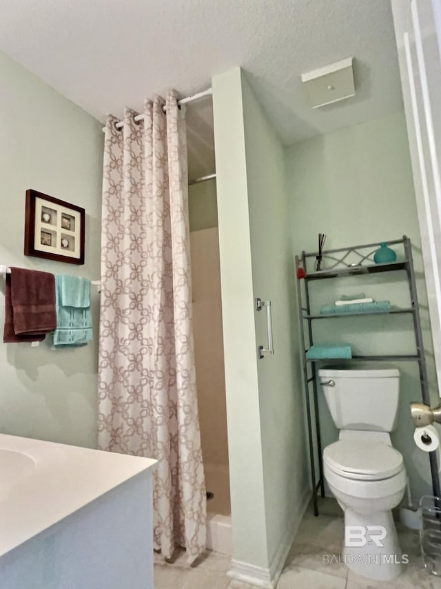 full bathroom with vanity, a shower stall, and toilet