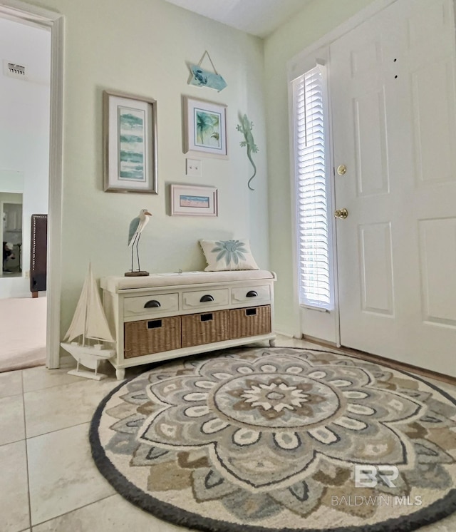 foyer entrance featuring visible vents and tile patterned floors