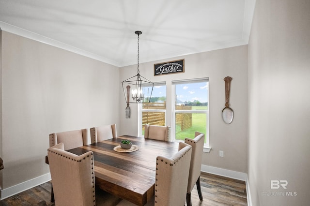 dining area featuring ornamental molding, a notable chandelier, dark wood-type flooring, and baseboards