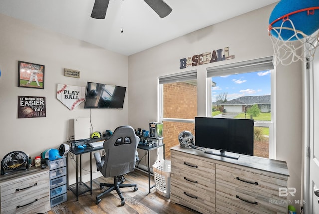 home office featuring a ceiling fan and wood finished floors