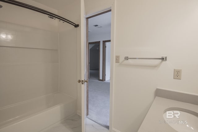 bathroom featuring shower / tub combination and sink