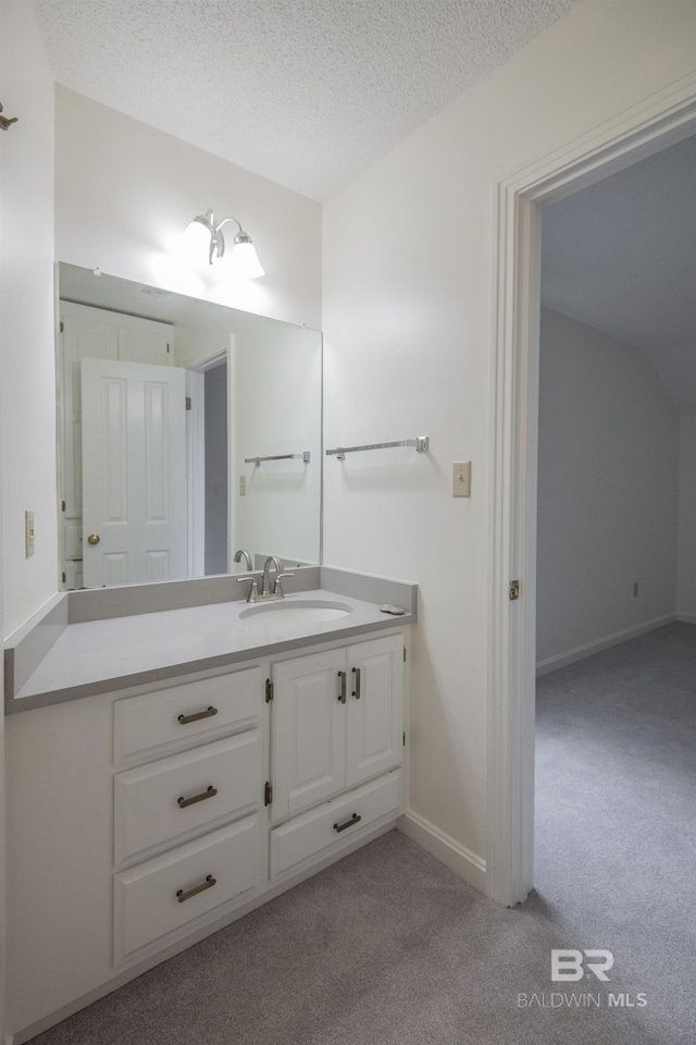 bathroom featuring vanity and a textured ceiling