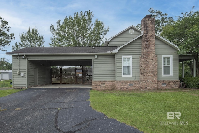 view of front of property with a garage and a front yard