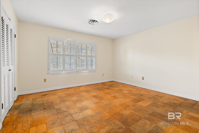 unfurnished bedroom featuring light parquet floors