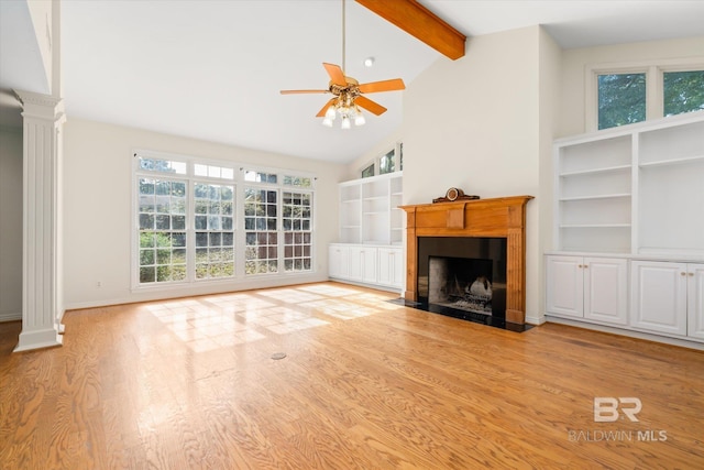 unfurnished living room featuring lofted ceiling with beams, ceiling fan, ornate columns, and light hardwood / wood-style flooring