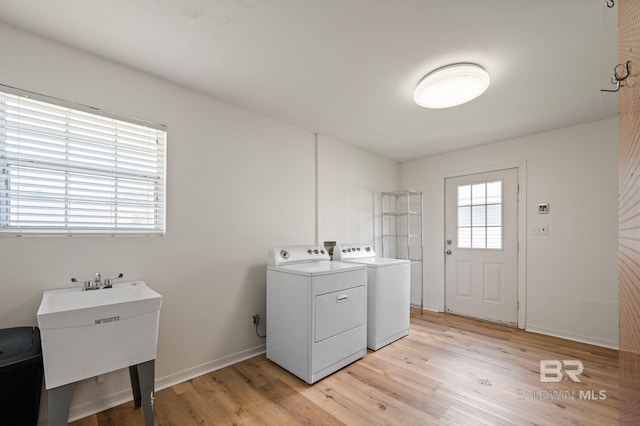 211 Fels Ave, Fairhope, AL 36532 - laundry area featuring laundry area, a sink, light wood-style floors, separate washer and dryer, and baseboards