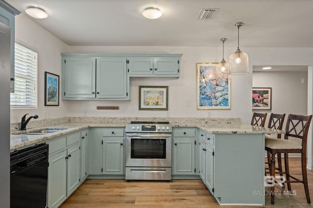 211 Fels Ave, Fairhope, AL 36532 - kitchen with visible vents, a peninsula, black dishwasher, a sink, and stainless steel electric range oven