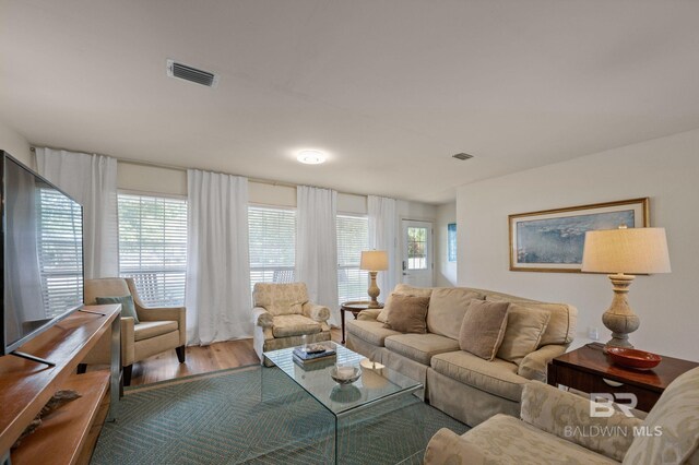 211 Fels Ave, Fairhope, AL 36532 - living area with visible vents, a healthy amount of sunlight, and wood finished floors