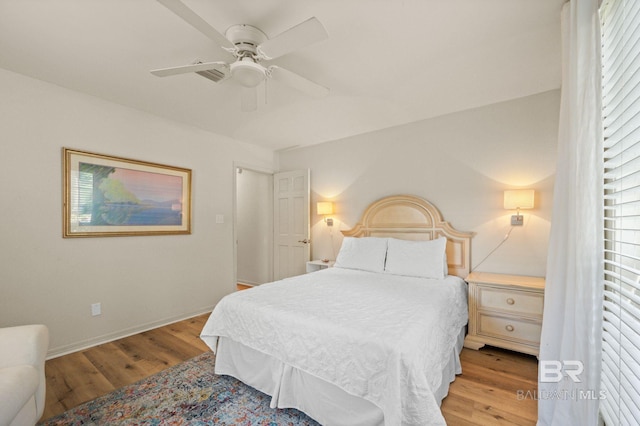 211 Fels Ave, Fairhope, AL 36532 - bedroom with baseboards, a ceiling fan, and wood finished floors