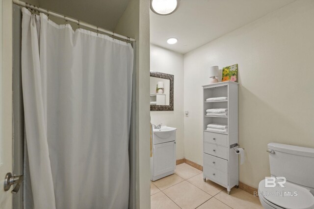 211 Fels Ave, Fairhope, AL 36532 - bathroom featuring vanity, tile patterned flooring, baseboards, and toilet