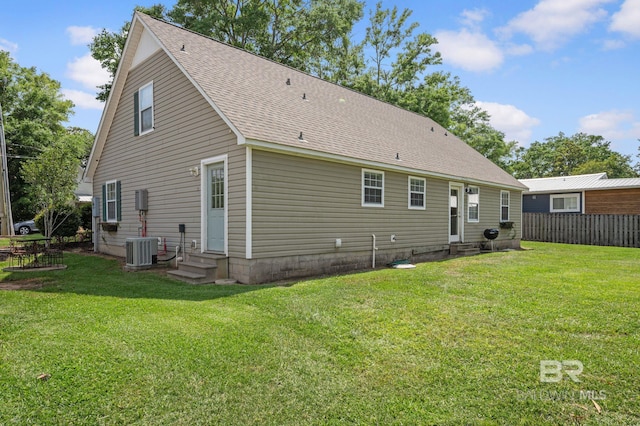 211 Fels Ave, Fairhope, AL 36532 - back of property featuring entry steps, a lawn, cooling unit, and fence