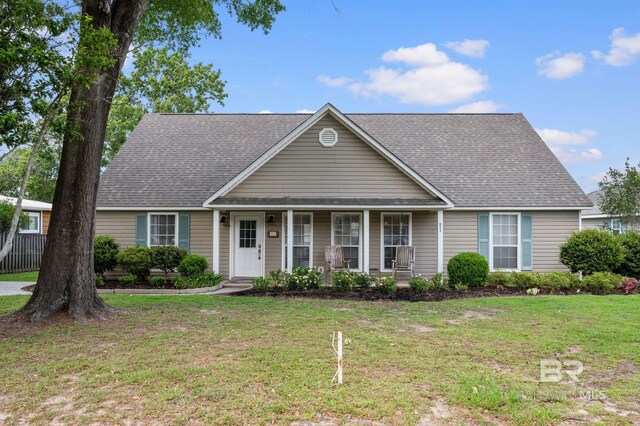 211 Fels Ave, Fairhope, AL 36532 - view of front of home featuring a porch, roof with shingles, and a front lawn