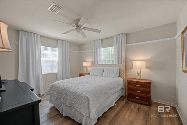 211 Fels Ave, Fairhope, AL 36532 - bedroom with baseboards, ceiling fan, wood finished floors, and visible vents