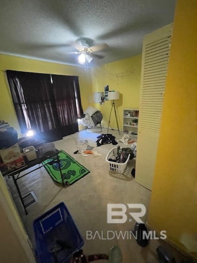 114 Dewitt Cir, Daphne, AL 36526 - unfurnished bedroom with ceiling fan and a textured ceiling