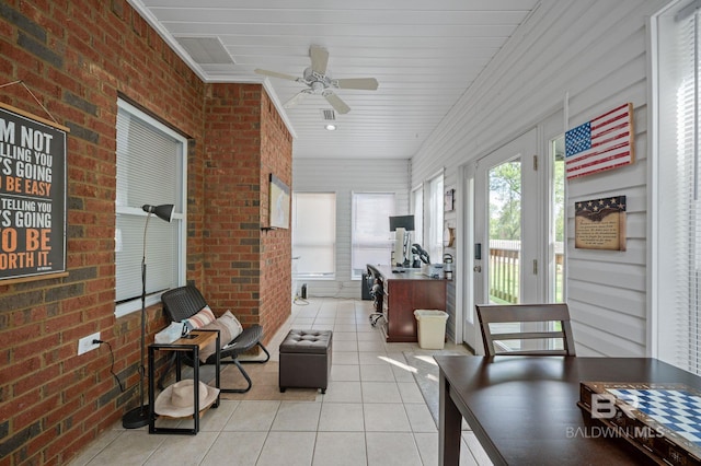 16520 Gaineswood Dr, Fairhope, AL 36532 - sunroom featuring tile patterned flooring, ceiling fan, and brick wall