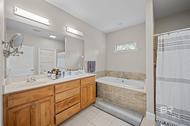 16520 Gaineswood Dr, Fairhope, AL 36532 - full bathroom with tile patterned floors, a garden tub, double vanity, and a shower with shower curtain