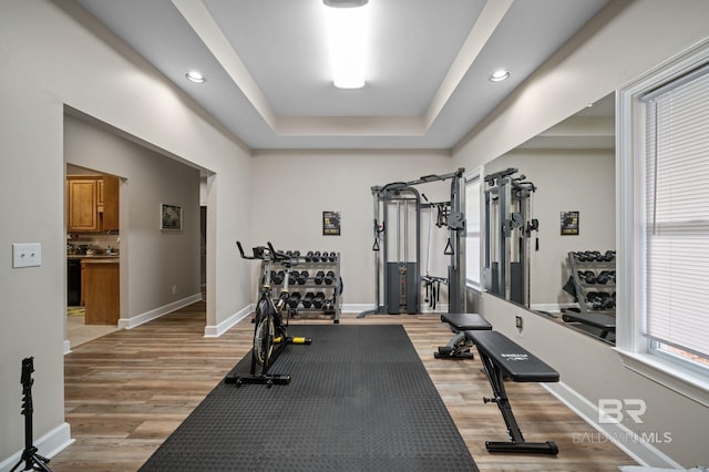 16520 Gaineswood Dr, Fairhope, AL 36532 - exercise room featuring light wood-style floors, baseboards, a raised ceiling, and recessed lighting