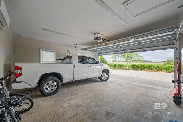 16520 Gaineswood Dr, Fairhope, AL 36532 - garage featuring a wall mounted AC and a garage door opener