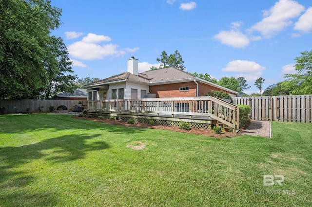 16520 Gaineswood Dr, Fairhope, AL 36532 - rear view of house featuring a deck, a chimney, and brick siding