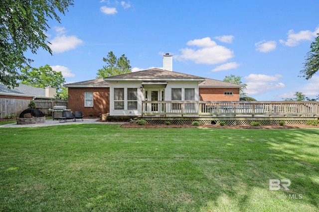 16520 Gaineswood Dr, Fairhope, AL 36532 - back of property featuring a deck, a patio area, a chimney, and brick siding