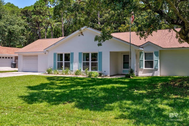 ranch-style home featuring a garage and a front lawn