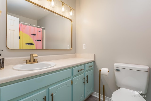 bathroom with vanity and toilet