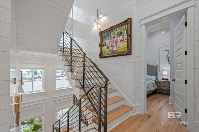 staircase featuring wood finished floors