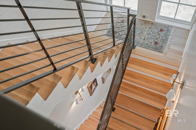 staircase with wood finished floors